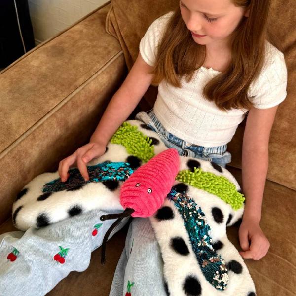 Beschwerter taktiler Schmetterling mit Glitzer